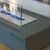 Kira Chimenea Bioetanol de mesa Elementi Fires en color gris, diseño compacto y portátil para uso interior o exterior