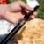 Pala para pizza mediana de Alfa Forni en acero inoxidable con mango negro