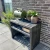 Mesa de láminas de madera negra de Kabeltromlen para uso exterior