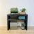 Mesa de láminas de madera negra de Kabeltromlen