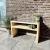 Mesa de láminas de madera clara de Kabeltromlen para exteriores
