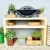 Mesa de láminas de madera clara de Kabeltromlen para exteriores