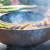Onyx Ø60 brasero con parrilla y almacenamiento de leña  