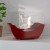 Chimenea de bioetanol curva en rojo de ScandiFlames, modelo de sobremesa