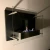 Chimenea de bioetanol de pared negro con cristal de seguridad. Su peso de 10kg lo hace fácil de montar.