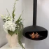 Chimenea de bioetanol colgada. Con forma ovalada, en acero de color negro
